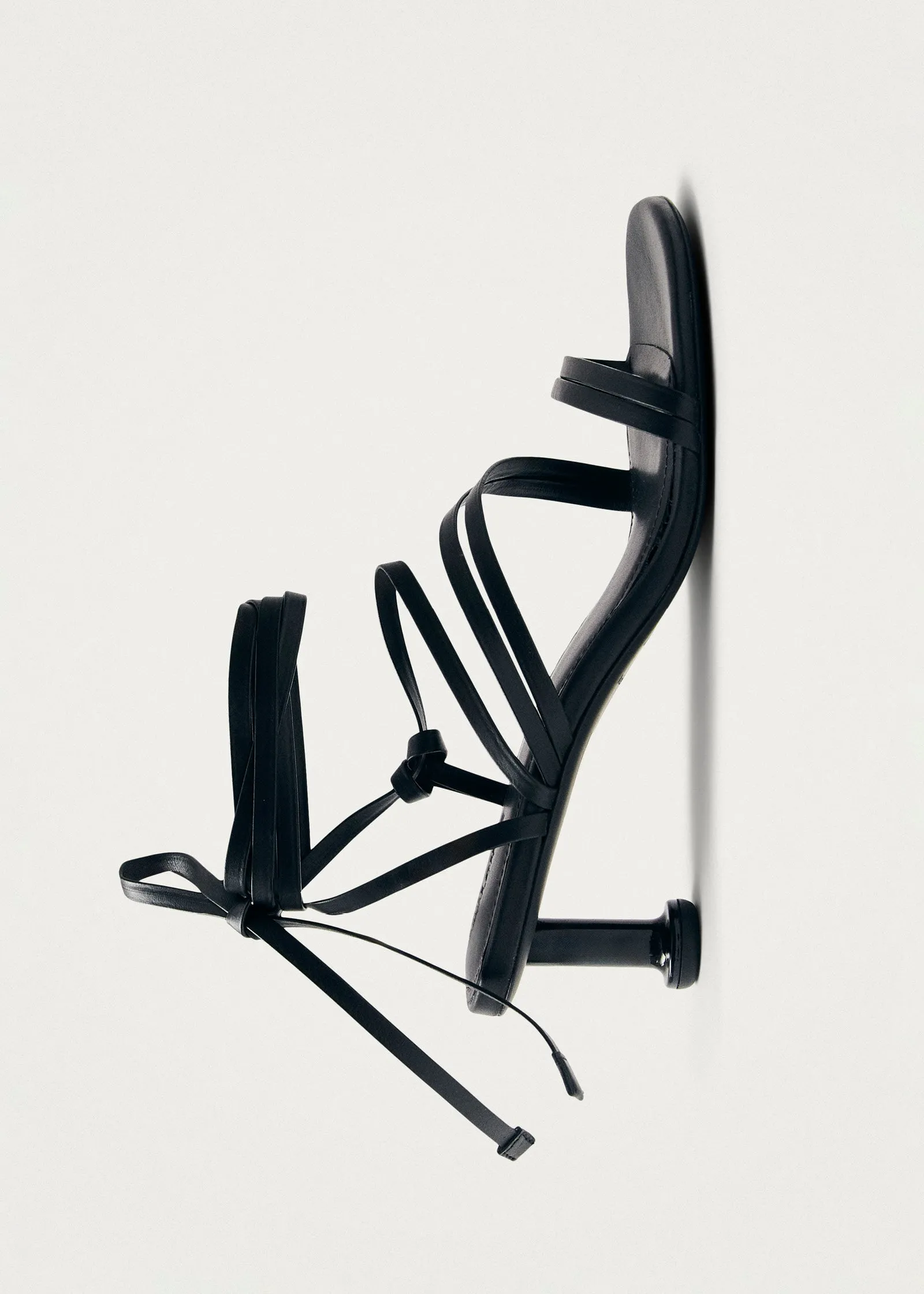 Curly Black Leather Sandals