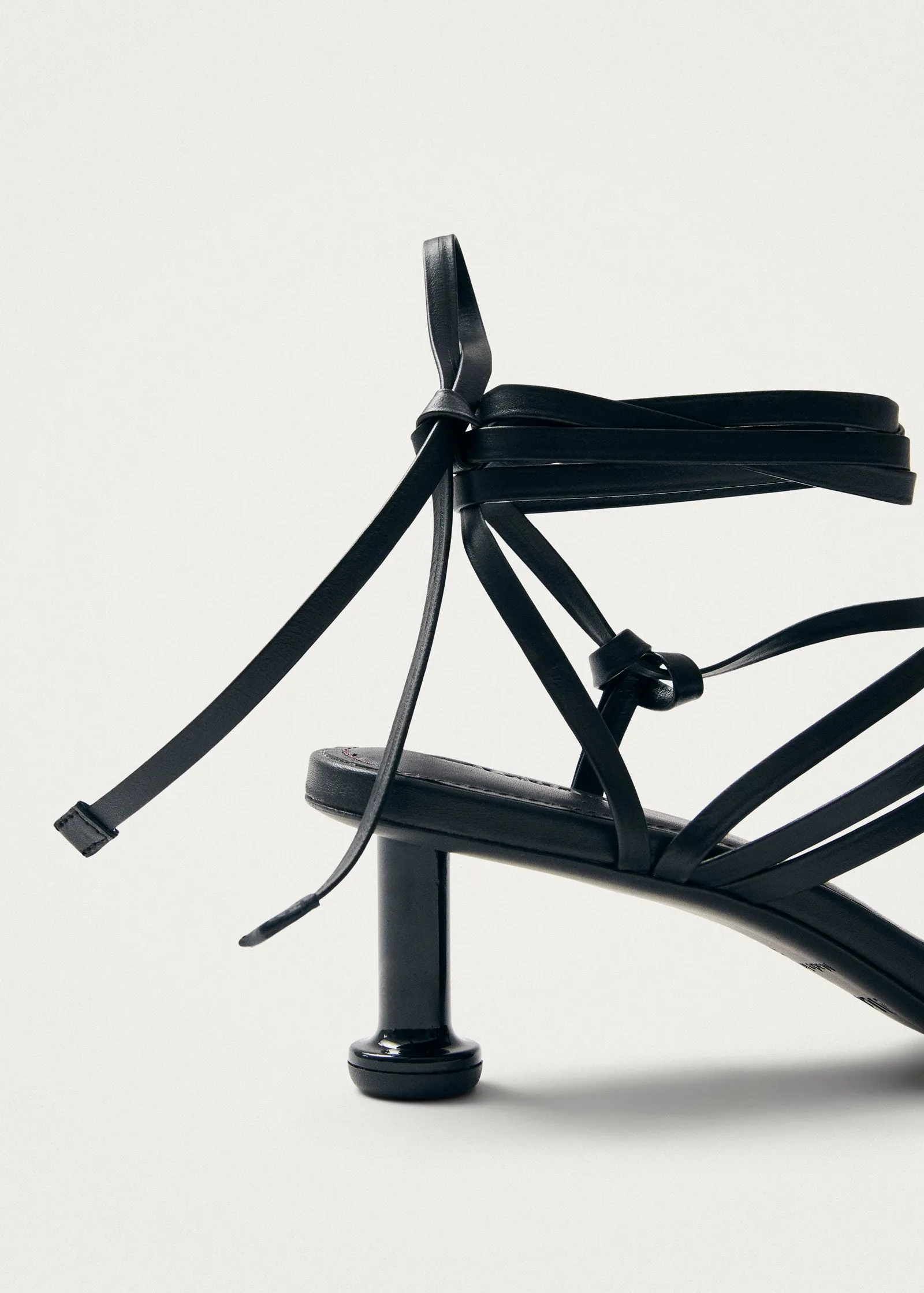 Curly Black Leather Sandals
